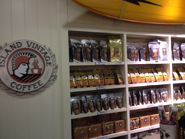 A shelf filled with bags of coffee