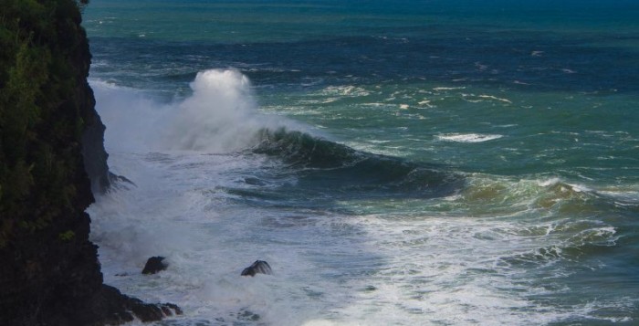 waves crashing  on the shore of Napali Coast on Kauai