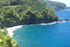 Hana Maui Beach A beach in Hana bordered by a winding road