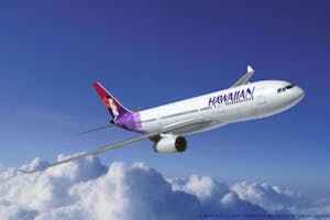 Hawaiian Jet In Clouds A Hawaiian Airlines jet soars above the clouds